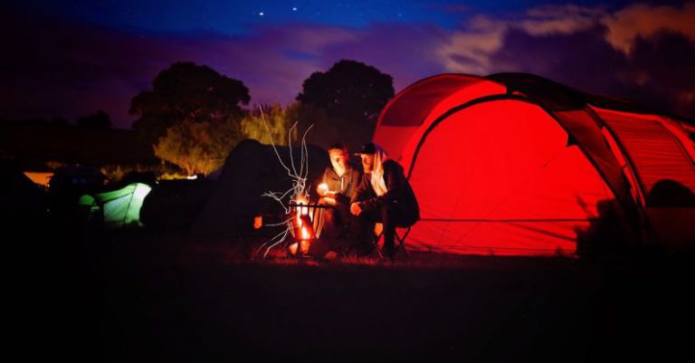 Camping - Man and Woman Sitting Beside Bonfire during Nigh Time