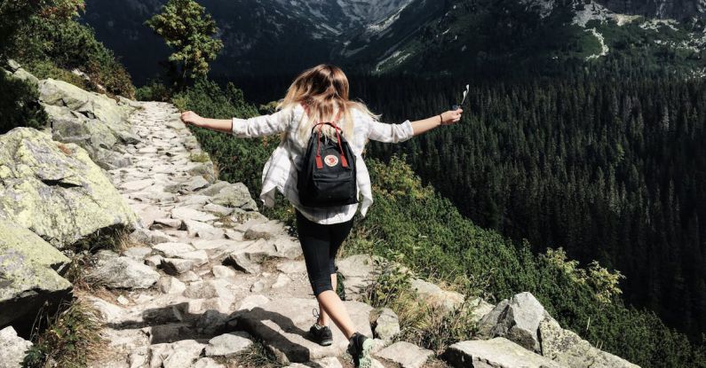 Hiking - Woman Standing on Cliff