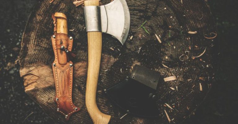 Bushcraft - Brown Wooden Axe Besides Brown Leather Knife Holster