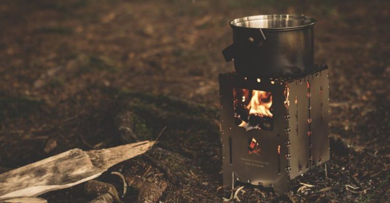 Bushcraft - Stainless Steel Pot on Brown Wood Stove Outside during Night Time