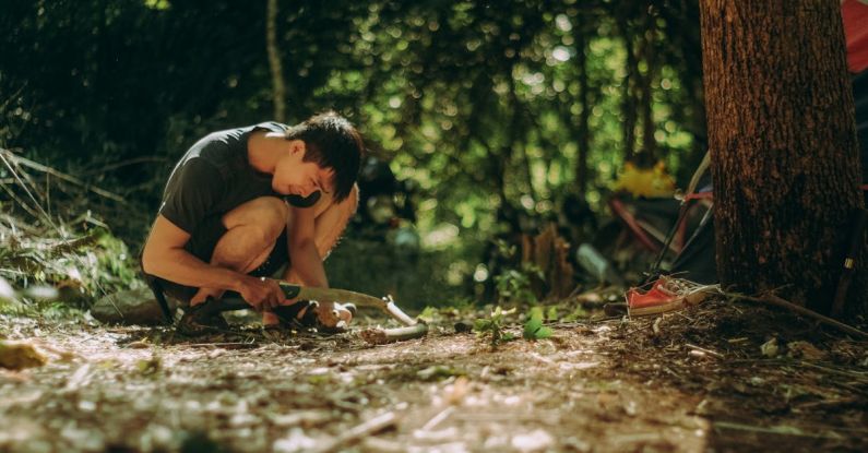 Bushcraft - A Man Cutting Woods