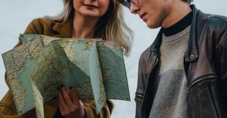 Hike Map - A man and woman looking at a map together