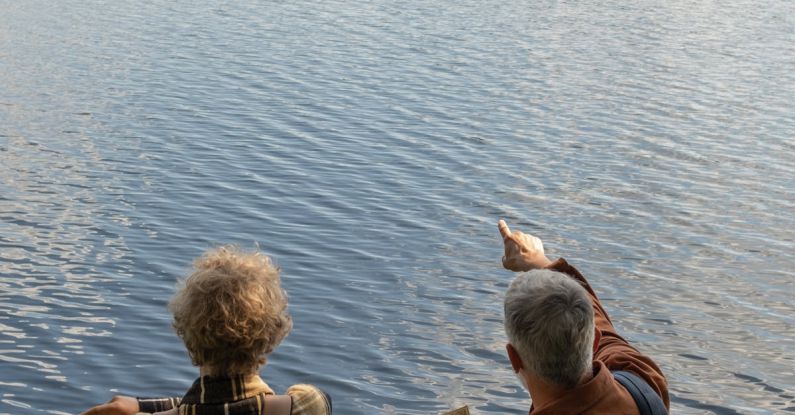 Hike Map - Grandfather with grandson Hiking with Map by Lake