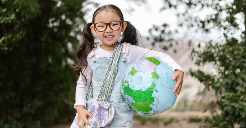 Hike Map - Smiling Girl Holding an Inflatable Globe