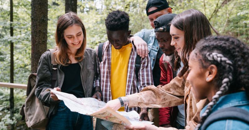 Hike Map - Group of Friends Looking on a Map