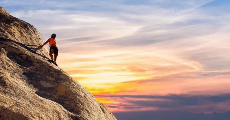 Climbing - Person Climbing on Mountain