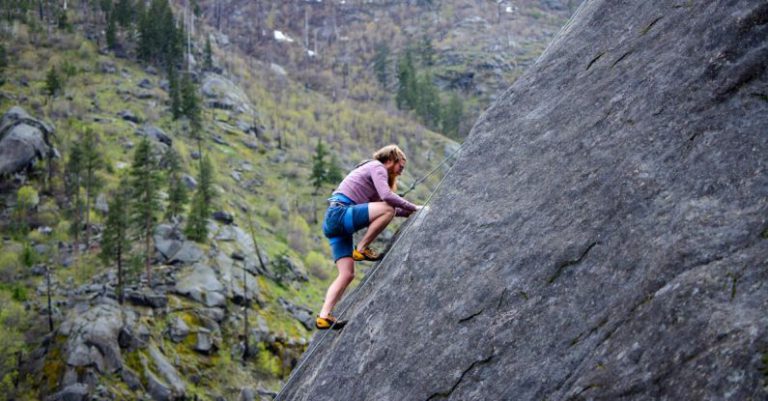 Climbing - Man Climbing on Rock Mountain