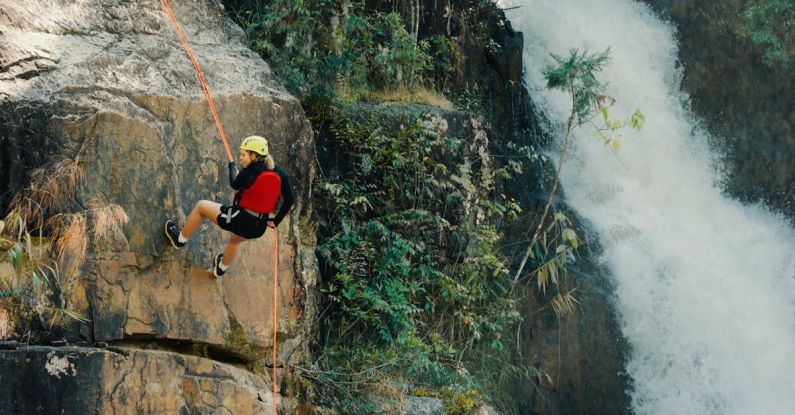 Climbing - Woman Rocking Climbing Near Waterfalls