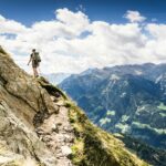 person-standing-on-top-of-mountain