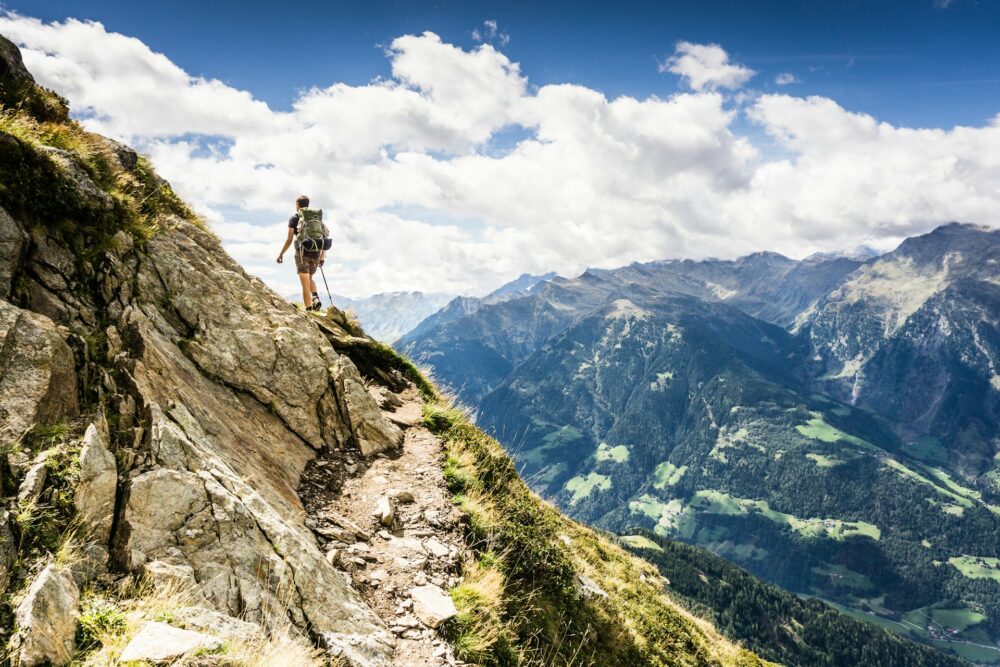 person-standing-on-top-of-mountain